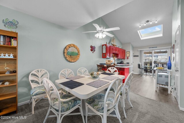 dining area with carpet and ceiling fan