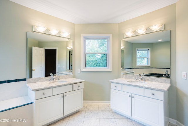 bathroom with vanity and a healthy amount of sunlight