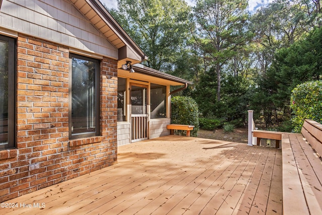 wooden terrace with a sunroom