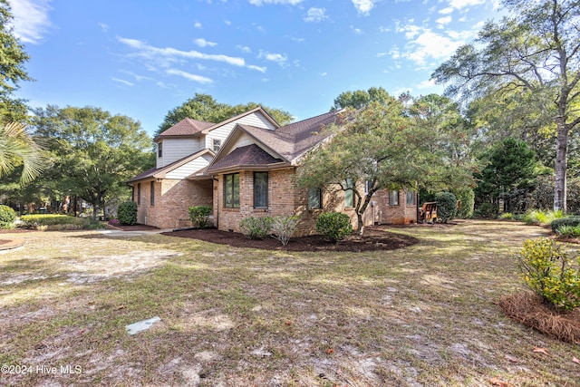 view of property exterior with a yard