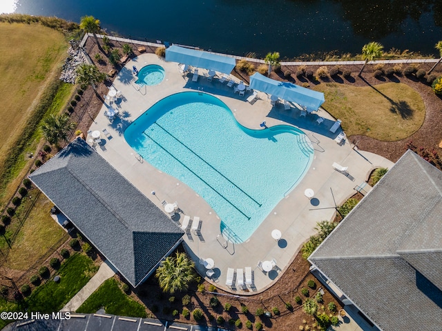 birds eye view of property with a water view