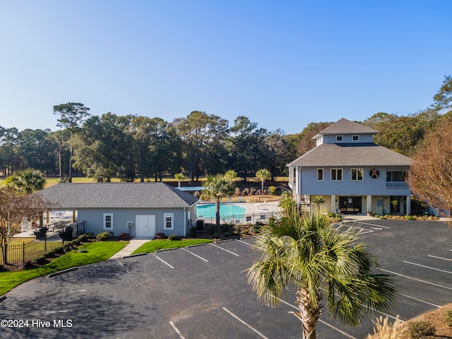 exterior space featuring a fenced in pool