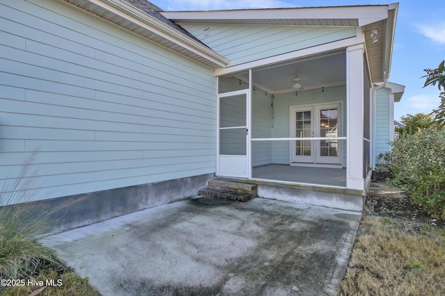 doorway to property featuring ceiling fan