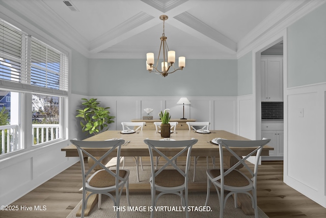 dining room featuring visible vents, beamed ceiling, wood finished floors, a notable chandelier, and coffered ceiling