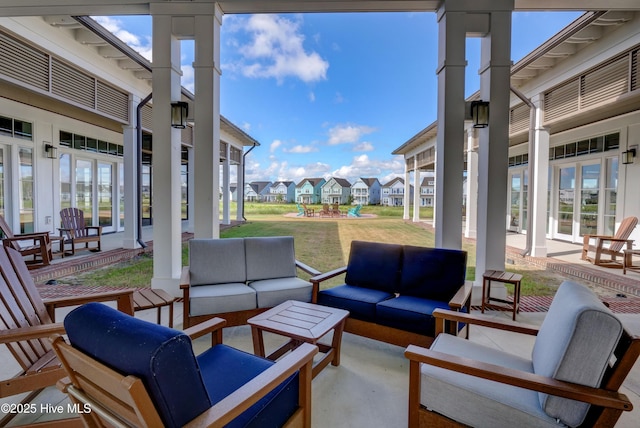 view of patio / terrace with a residential view and an outdoor living space