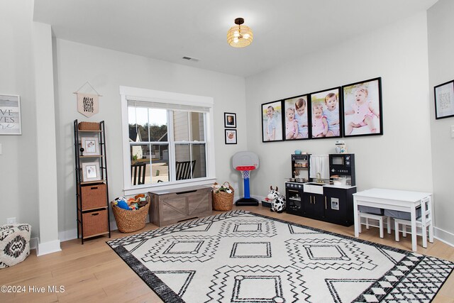 sitting room featuring light hardwood / wood-style floors