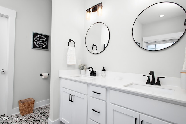 bathroom featuring tile patterned flooring and vanity