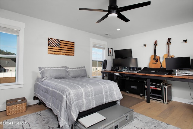 bedroom featuring hardwood / wood-style flooring and ceiling fan