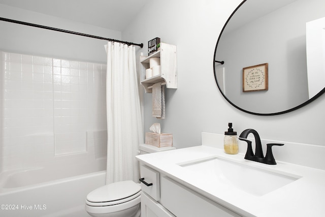 full bathroom featuring shower / tub combo with curtain, vanity, and toilet