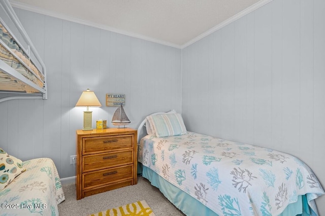 carpeted bedroom featuring crown molding