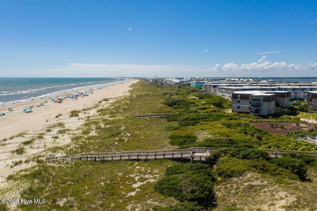 birds eye view of property with a view of the beach and a water view