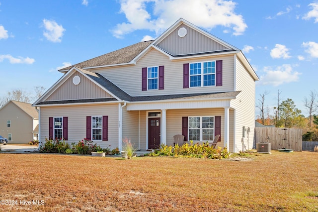 view of property featuring a front yard and central AC