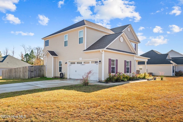 view of home's exterior with a garage and a yard