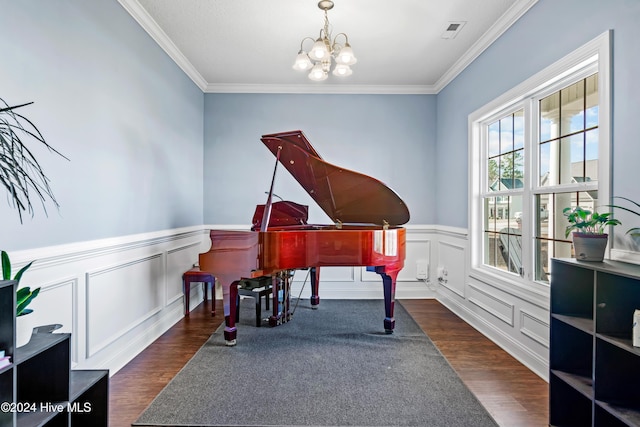 miscellaneous room featuring a notable chandelier, dark hardwood / wood-style floors, and crown molding