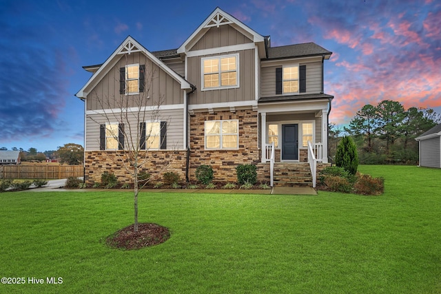 craftsman-style home with a lawn