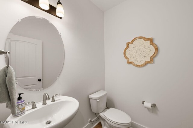 bathroom with sink and toilet