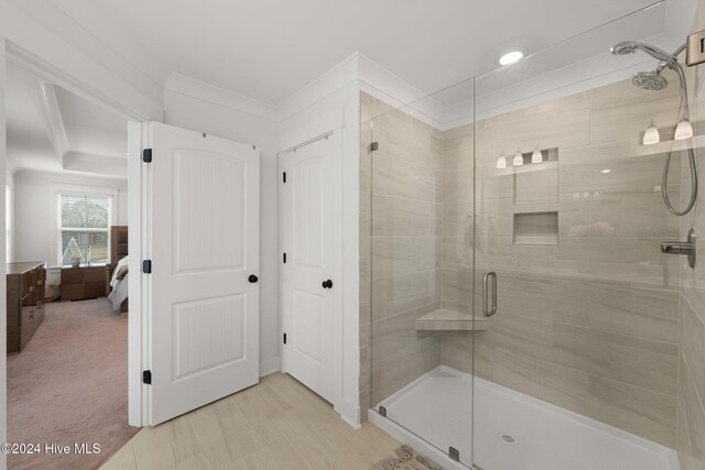 bathroom featuring a shower with shower door