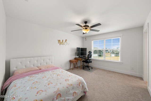 carpeted bedroom with ceiling fan