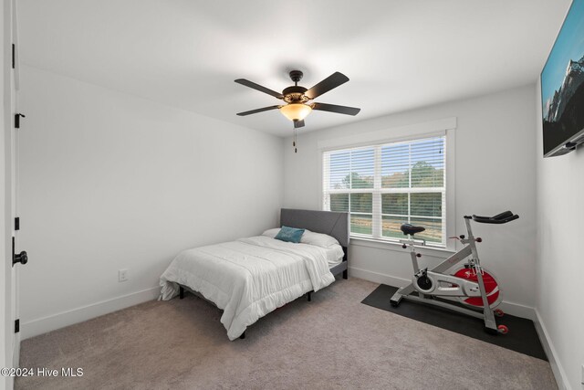 bedroom featuring ceiling fan and carpet flooring