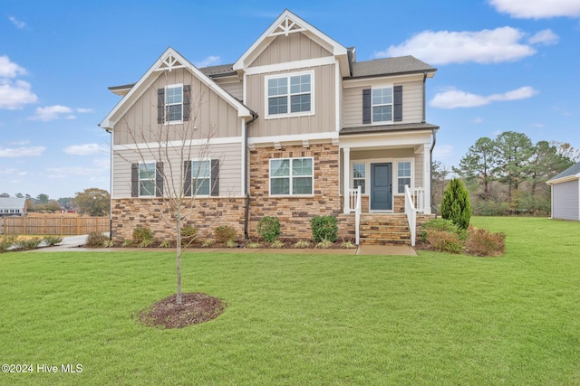 craftsman-style house featuring a front lawn