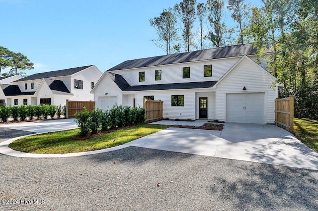 modern inspired farmhouse featuring a garage