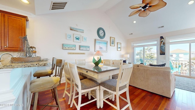 dining space featuring beamed ceiling, ceiling fan, dark wood-type flooring, and high vaulted ceiling