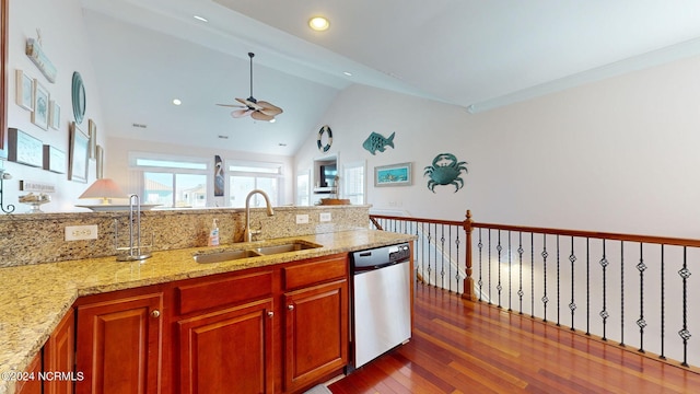 kitchen featuring light stone countertops, dark hardwood / wood-style flooring, stainless steel dishwasher, sink, and high vaulted ceiling