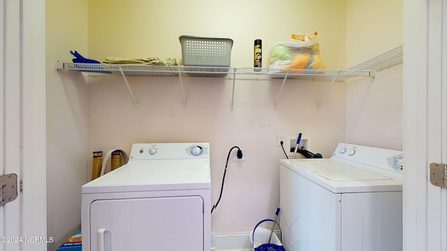 clothes washing area with washer and dryer