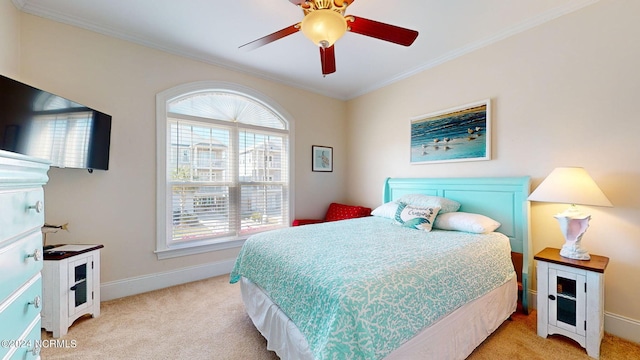 bedroom with light carpet, ceiling fan, and ornamental molding