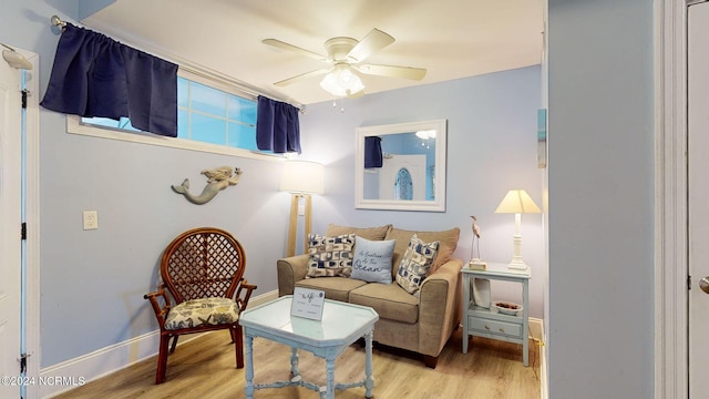 sitting room featuring light hardwood / wood-style flooring and ceiling fan