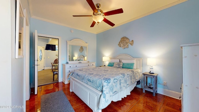 bedroom featuring dark hardwood / wood-style floors, ceiling fan, and ornamental molding