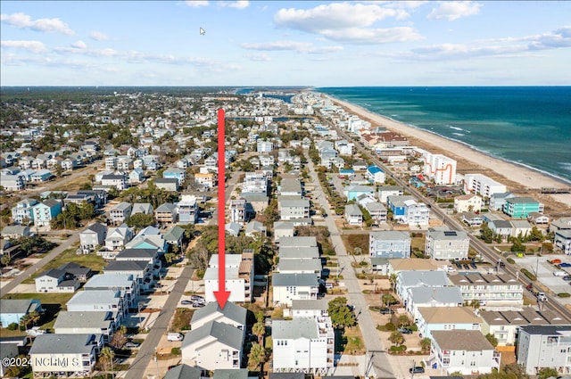 drone / aerial view with a water view and a beach view