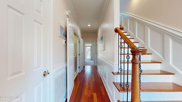 hall featuring dark hardwood / wood-style flooring and ornamental molding