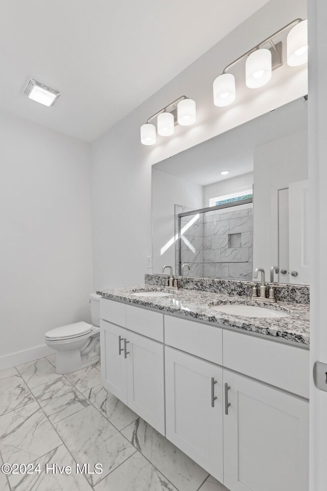 kitchen with white cabinets, light stone countertops, sink, and appliances with stainless steel finishes