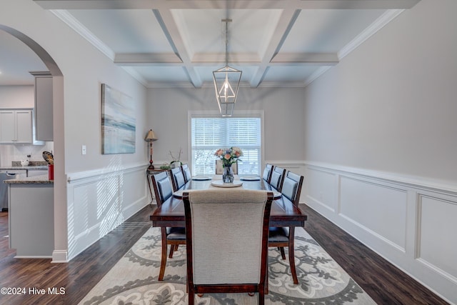 dining room with beam ceiling, crown molding, dark hardwood / wood-style flooring, and coffered ceiling