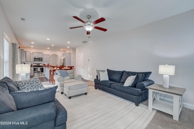 living room with ceiling fan