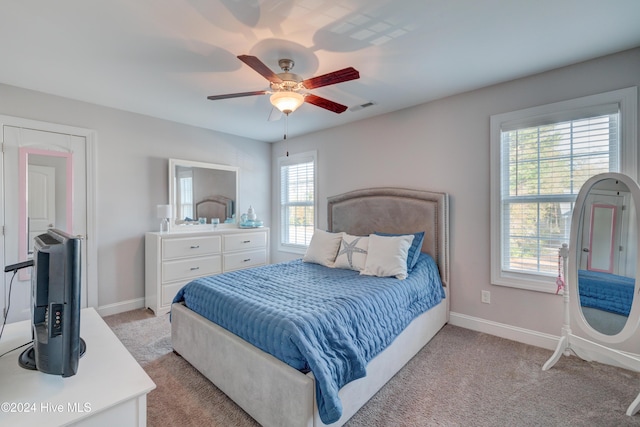 carpeted bedroom featuring ceiling fan