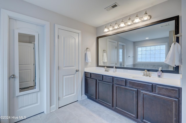 bathroom with tile patterned floors and vanity