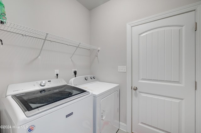 laundry room with washer and clothes dryer