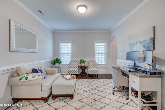 home office featuring light wood-type flooring and crown molding