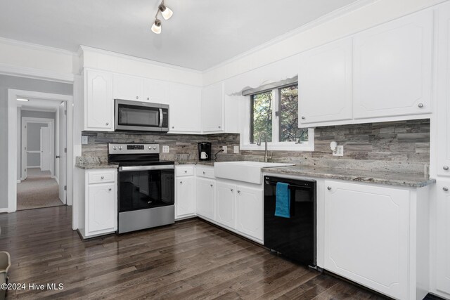 kitchen with sink, dark hardwood / wood-style flooring, decorative backsplash, white cabinets, and appliances with stainless steel finishes