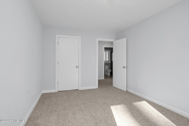 unfurnished bedroom featuring carpet flooring