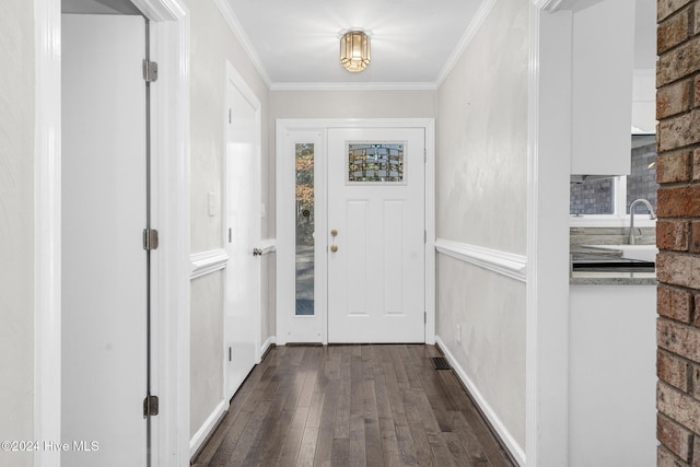 interior space featuring dark hardwood / wood-style flooring and ornamental molding