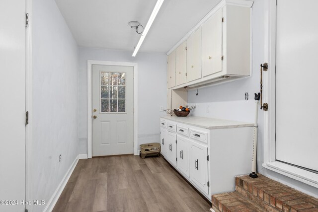 kitchen featuring white cabinets and light hardwood / wood-style floors