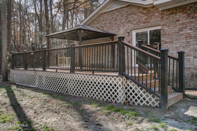 wooden deck with a gazebo