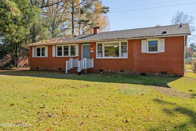 ranch-style home featuring a front yard