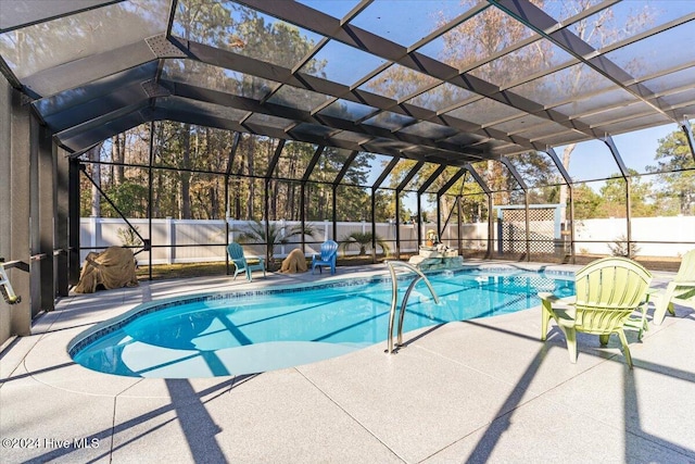 view of pool with a lanai and a patio area