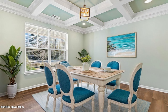 dining space with crown molding, a wealth of natural light, and dark hardwood / wood-style flooring