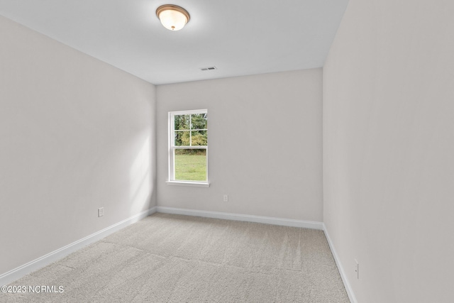 empty room featuring light colored carpet