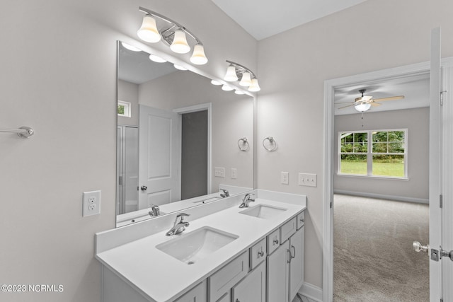 bathroom with ceiling fan and vanity